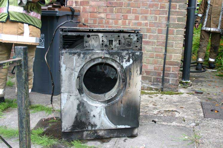 Stock image of a burnt out washing machine