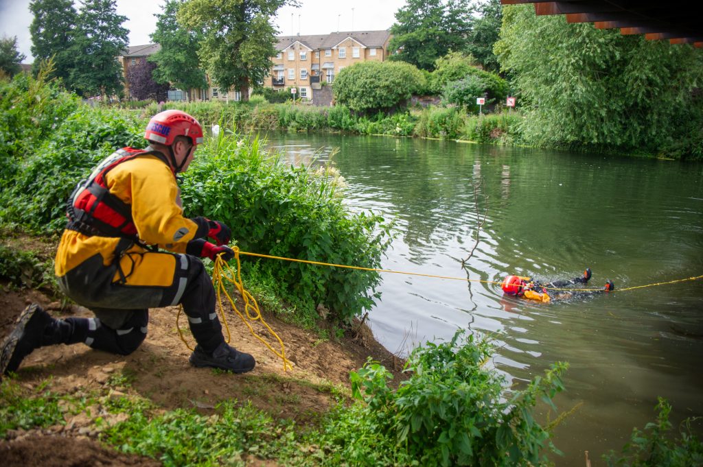 Staged water rescue is carried out by firefighters