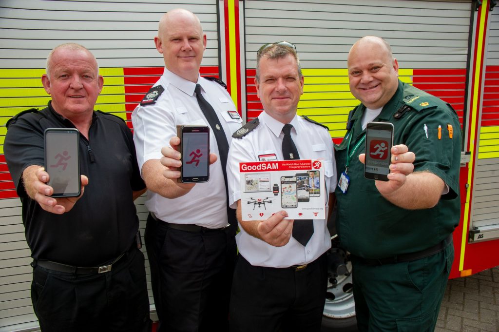 Staff from Northamptonshire Fire and Rescue Service and EMAS showing the GoodSam app