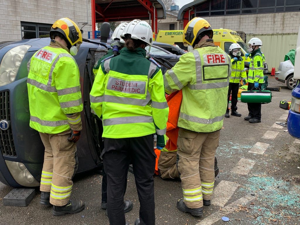 Firefighters, and paramedics conducting a joint training exercise