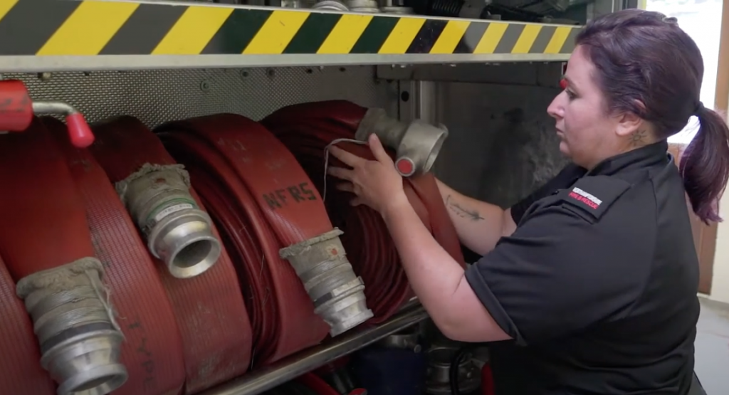 Firefighter Keri Worrall with hose