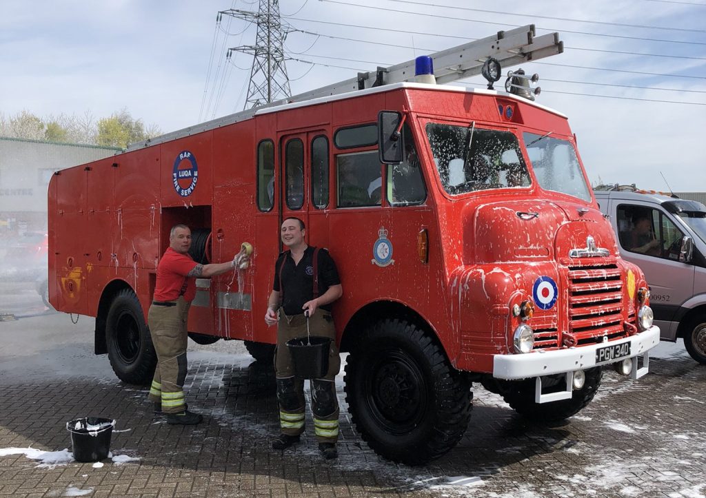 Firefighters cleaning an applaince