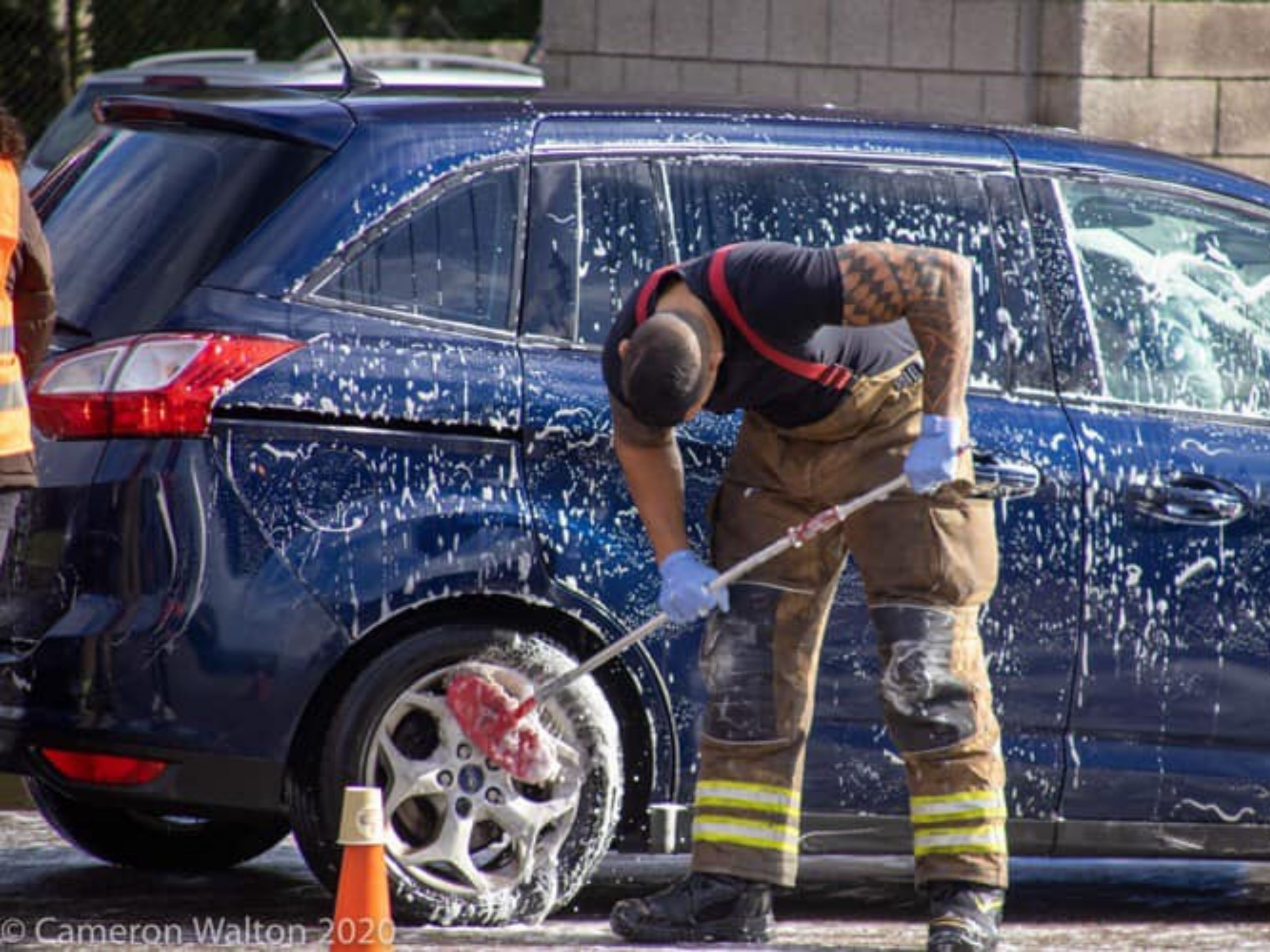 Firefighter washing car