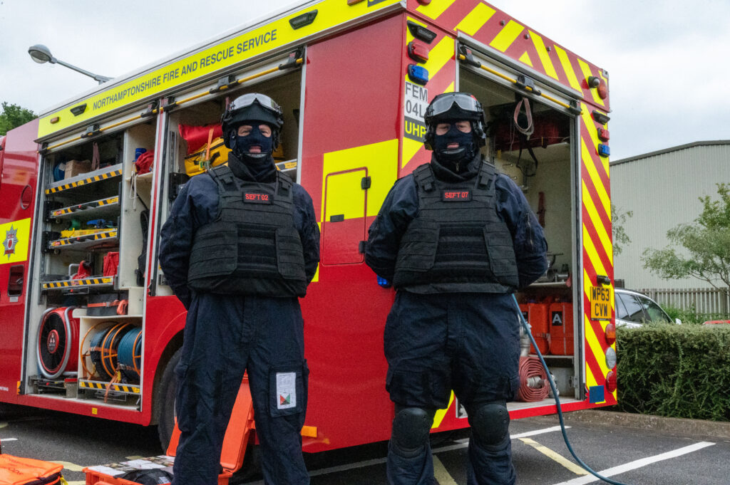 Two firefighters dressed in ballistic proof uniform to attend specific firearms incidents