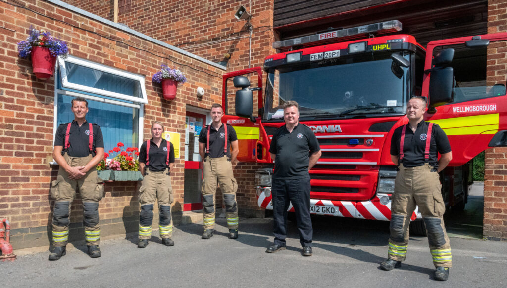 Station Manager and crew in front of fire appliance at Wellingborough Fire Station