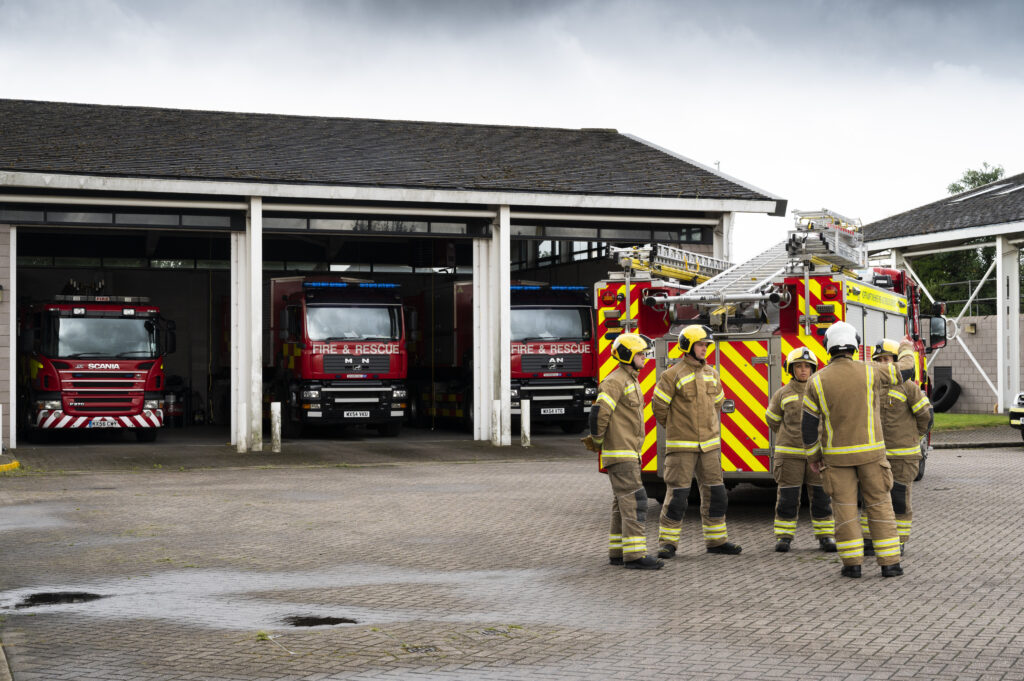 Crew in drill yard of Corby Fire Station