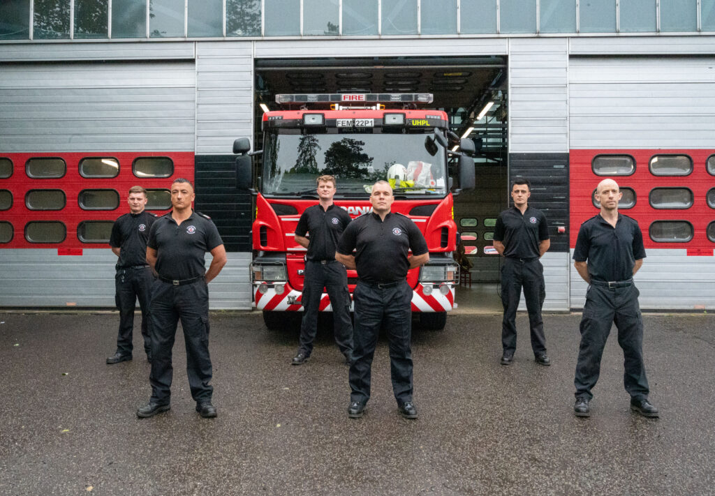 Station Manager and crew outside Rushden Fire Station in front of fire appliance