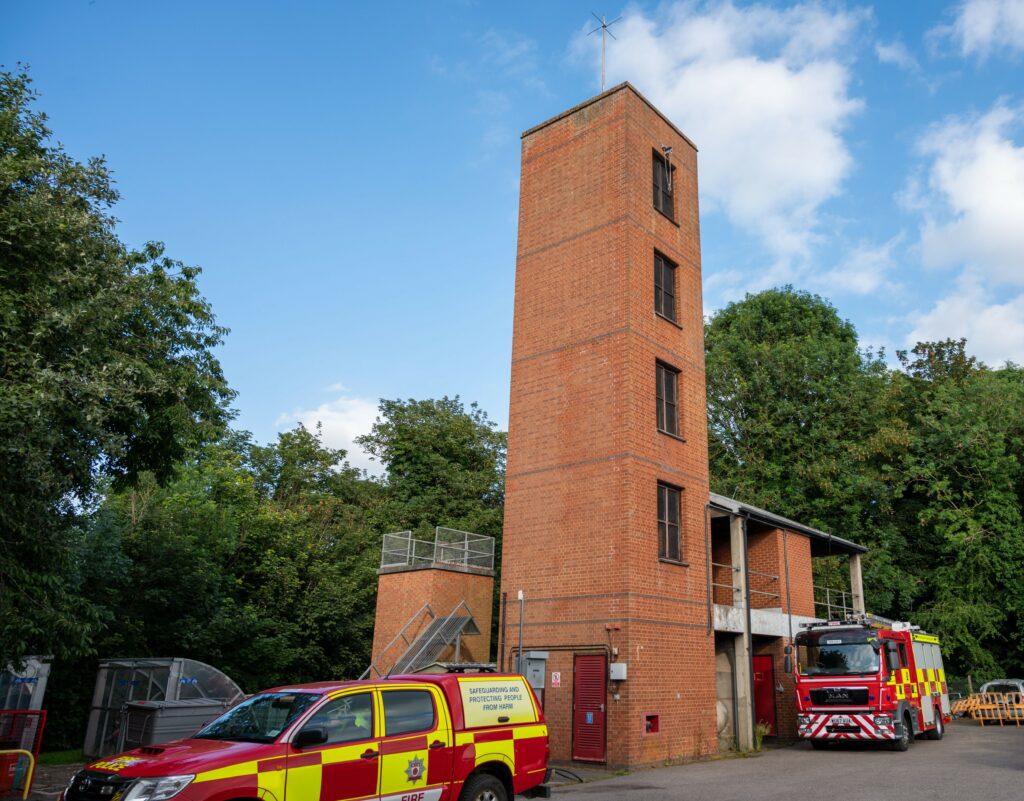 Drill tower and two fire vehicles at Rushden Fire Station