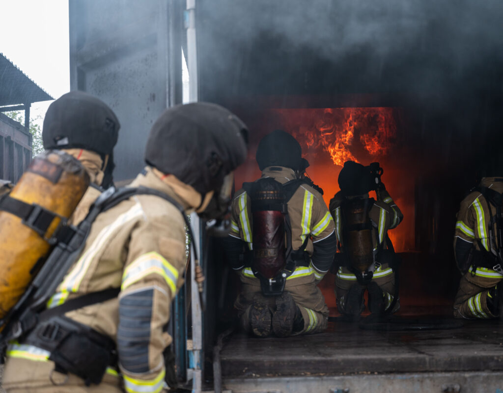 Firefighters inside training rig undertaking a training exercise