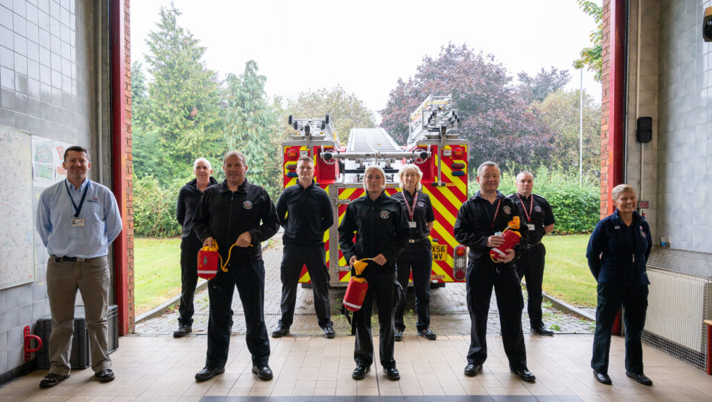 Staff lined up with water rescue equipment to support the waterside responder scheme