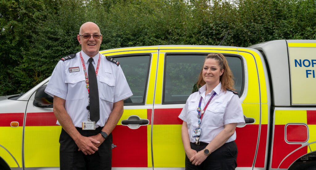 Arson Task Force colleagues in front of fire vehicle