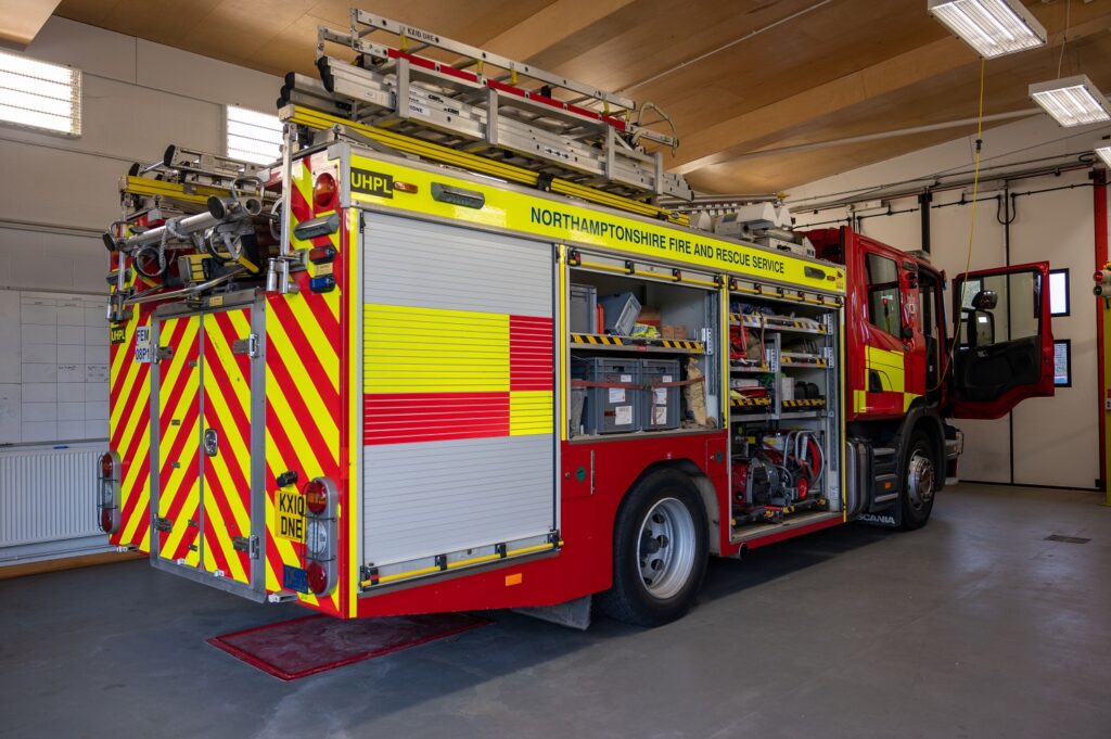 Side view of a fire appliance showing the equipment held inside