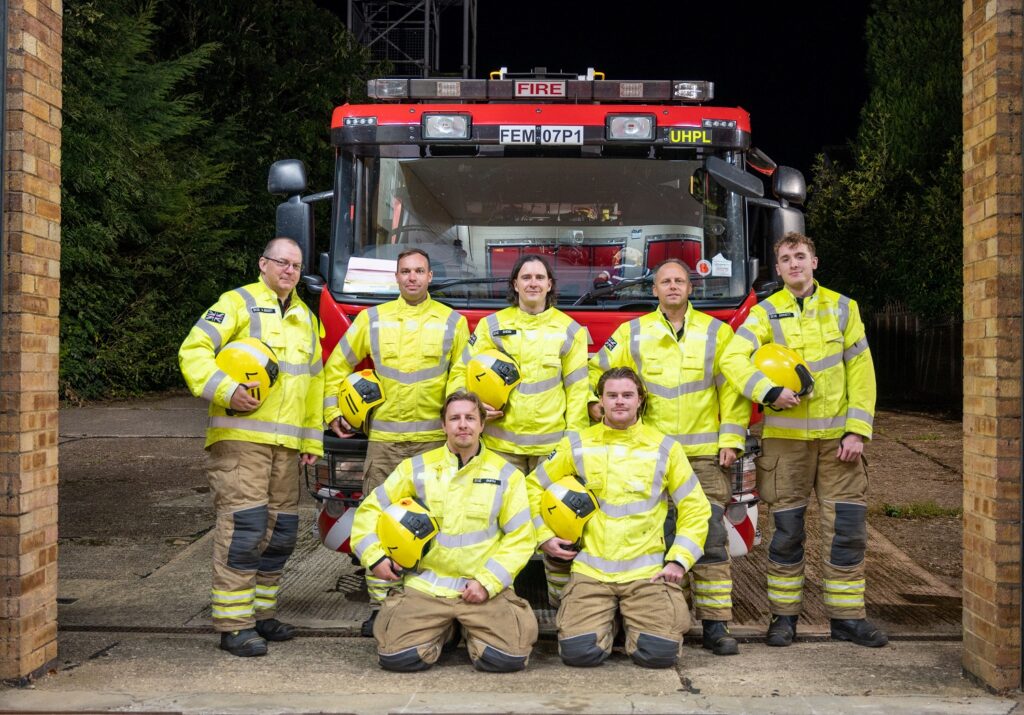 Crew from Brixworth Fire Station in front of fire appliance