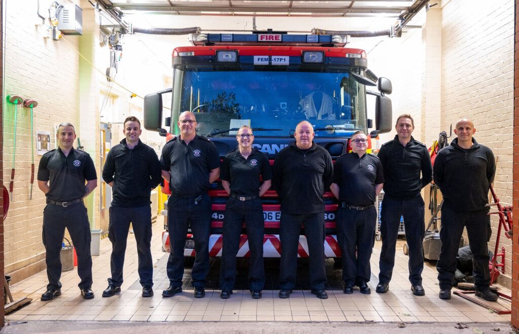 Crew from Burton Latimer in front of fire appliance