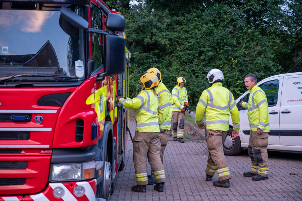 Crew members from Raunds Fire Station next to fire appliance