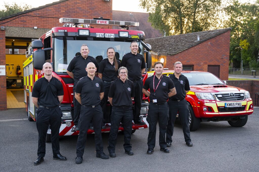 Crew from Desborough Fire Station in front of fire appliance