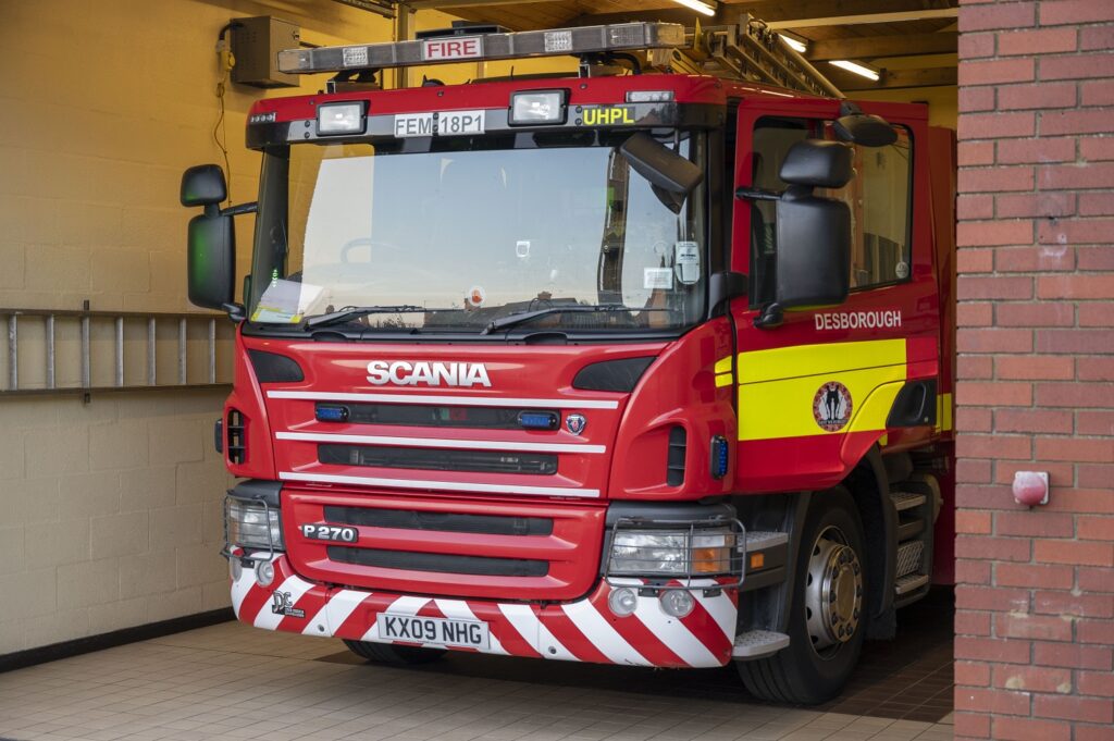 Fire appliance from Desborough Fire Station in appliance bay