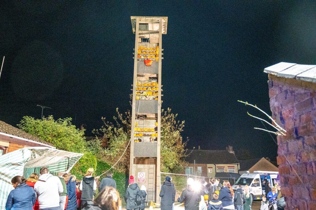 Rothwell Fire Station's drill tower lit up with pumpkins for a charity Halloween event