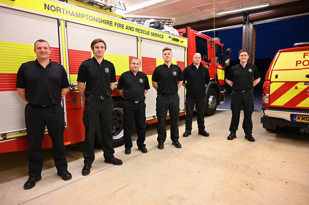 Crew members from Long Buckby Fire Station by fire appliance