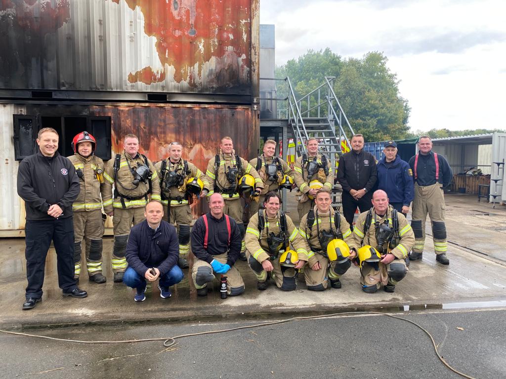 2 rows of firefighters and guests taken outside at training centre