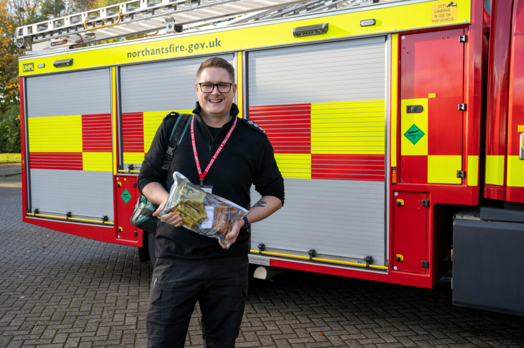 Station Commander Nick Gayton with one of the new bleed packs, in front of one of the fire engines that will carry them