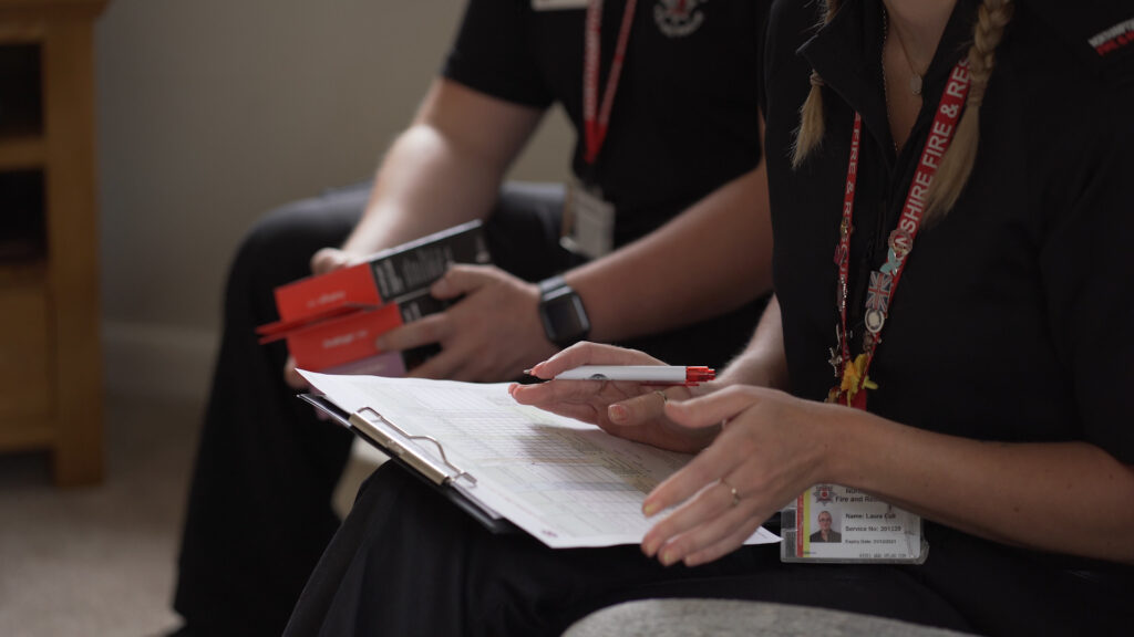 A picture showing Northamptonshire Fire and Rescue Service staff ensuring regulations are checked