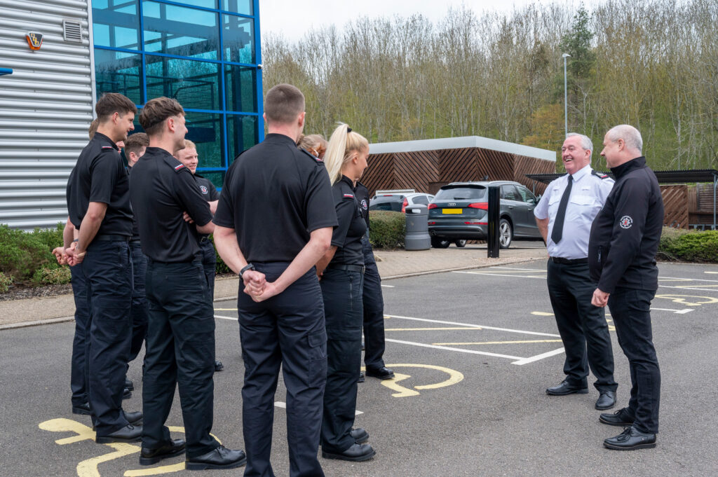 CFO Mark Jones and PFCC Stephen Mold talking to a new cohort of firefighter recruits outside Darby House 