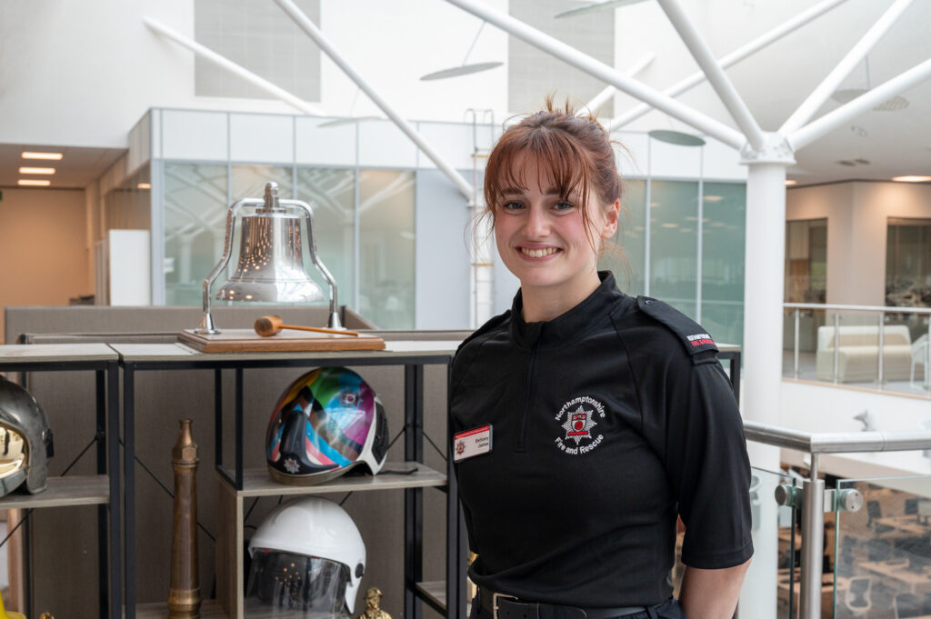 New firefighter Bethan James posing for a photo at Darby House 