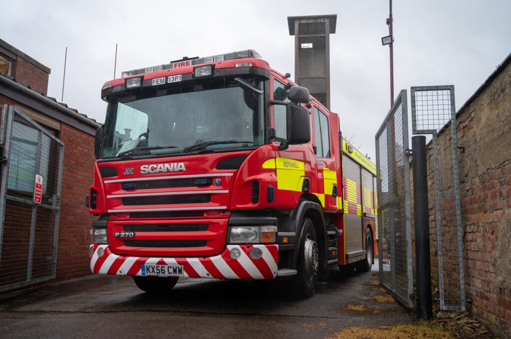 Rothwell Fire Engine by some gates at Rothwell Fire Station 