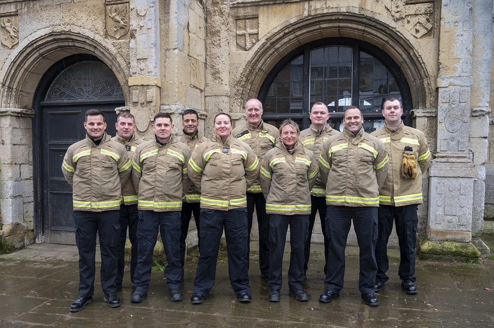 The on-call crew at Rothwell Fire Station, wearing their firefighter uniform, are pictured outside the Market House in April 2023