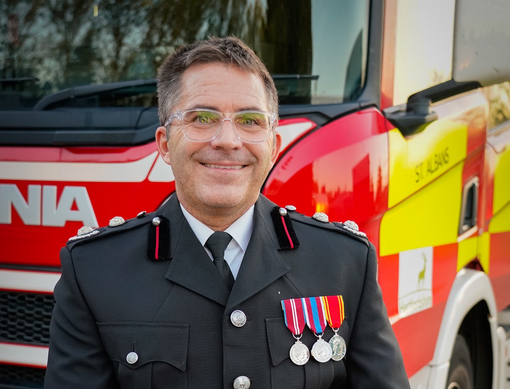 New Deputy Chief Fire Officer Simon Tuhill, in front of a fire engine