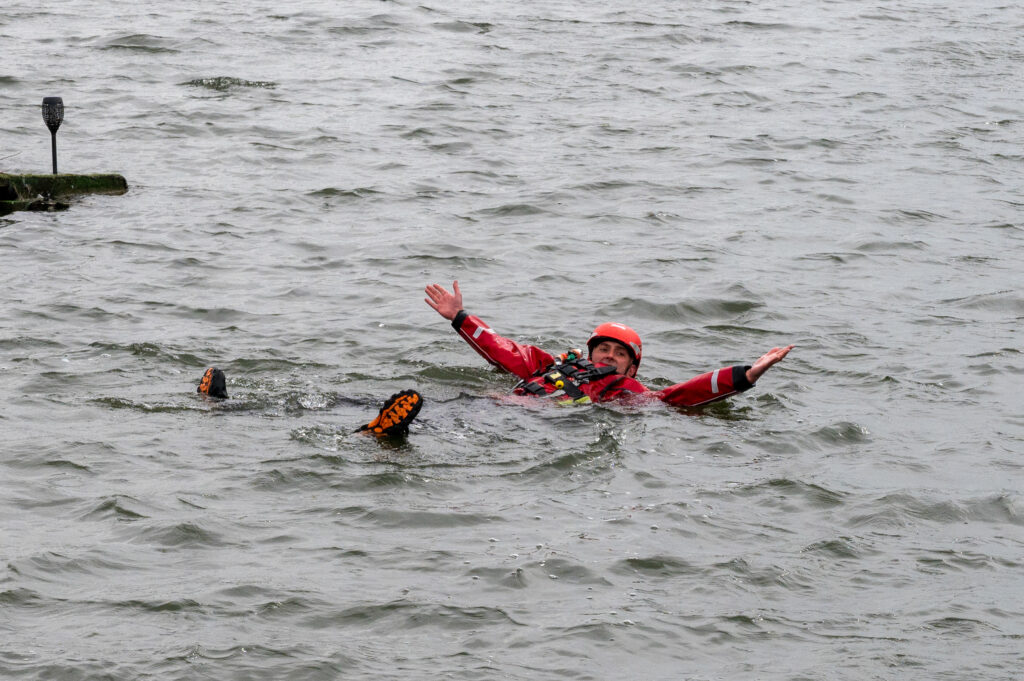 Firefighter floating in the water