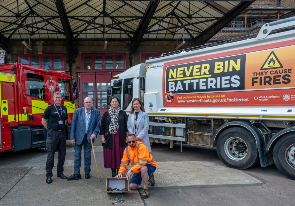 West Northants Council Waste lorry and Fire Appliance behind representatives from the council and Northants Fire