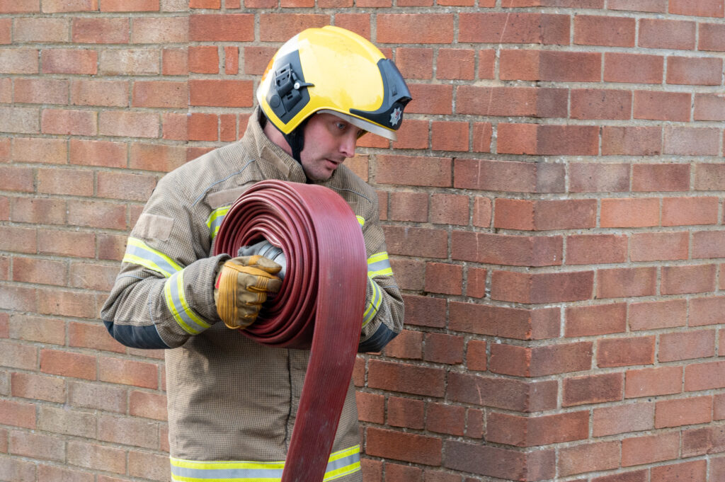 A firefighter with some hose