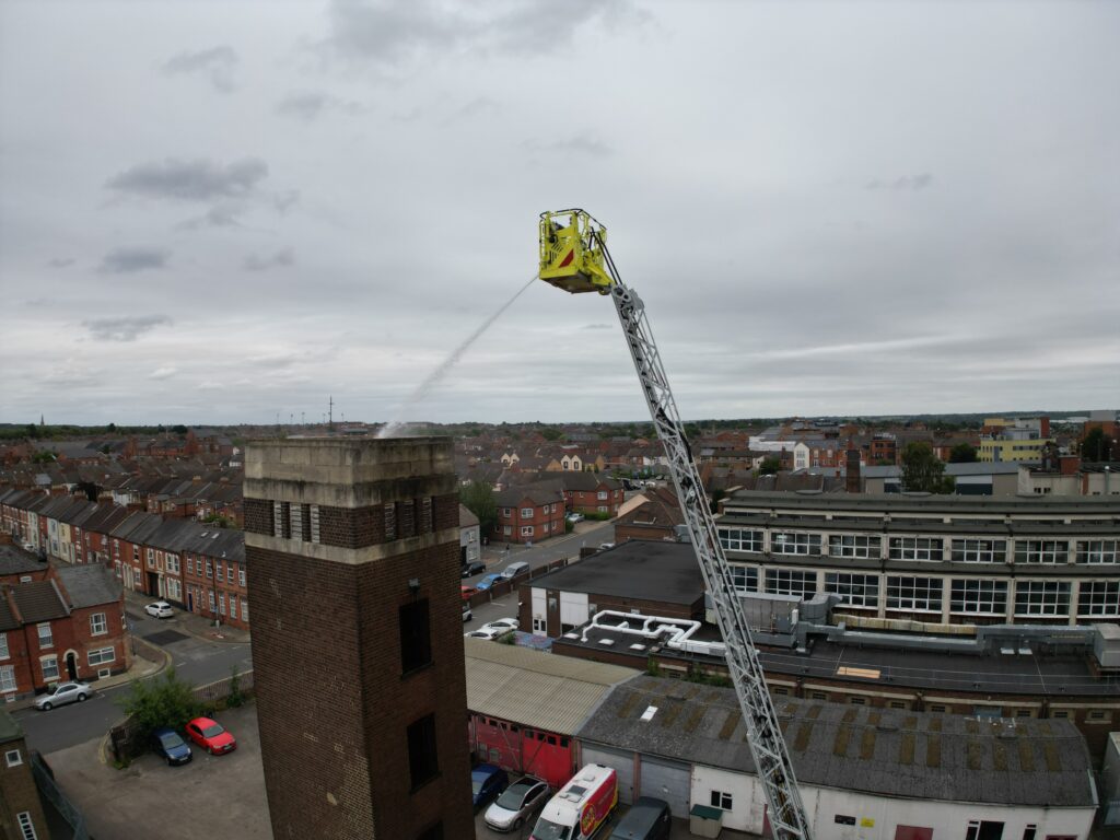 The Aerial Pump putting water on the top of the drill tower