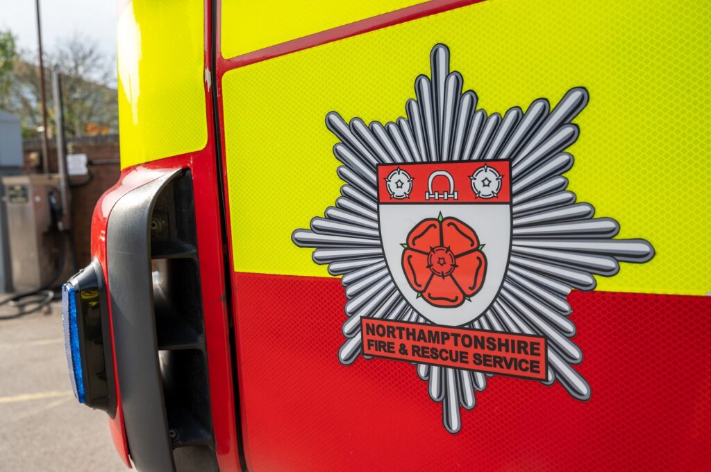 A photo of the NFRS logo on the side of a fire engine