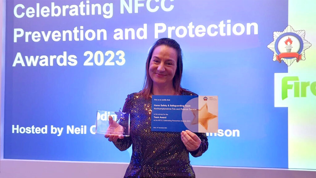 Prevention Team Leader Tina Collett displaying the award and certificate