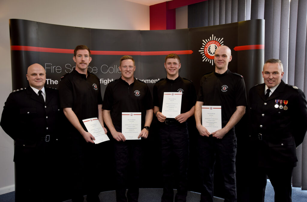 SM Rich Walding, the four new firefighters and AM Mick Berry posing with their certifciates
