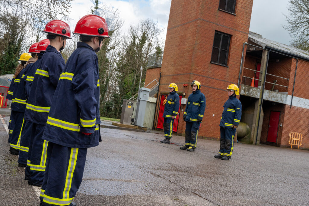 The young people during the drill, dressed in fire kit