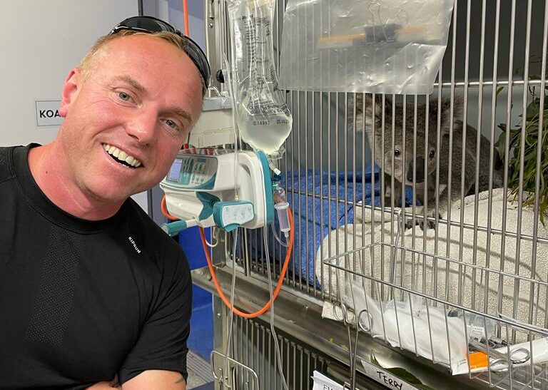 Firefighter Mick Titcombe observing a Koala during his Churchill Fellowship trip to Australia
