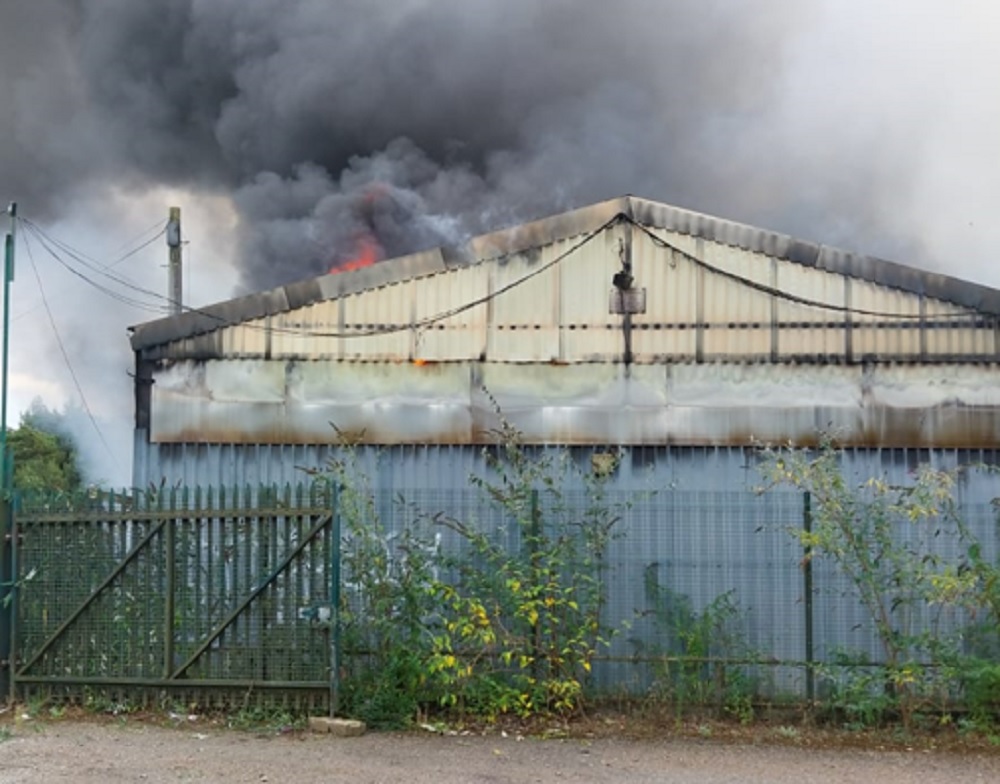 Fire crews tackle blaze at derelict industrial unit in Harlestone Firs