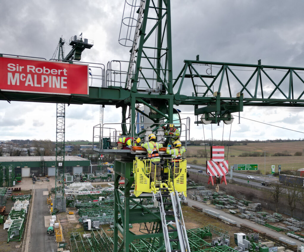 A photo - taken by a drone - of firefighters rescuing a dummy causality from a crane