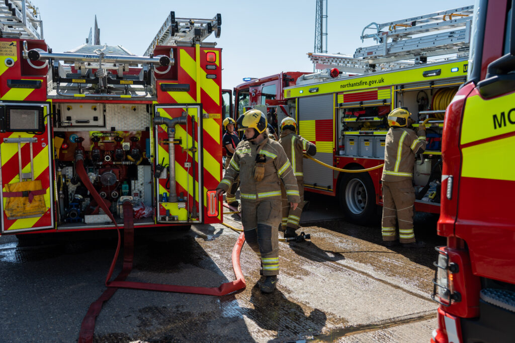 Firefighters were called to a mock scenario involving a mid-air collision of two aircraft earlier. The picture shows crews and two pumps at the scene.
