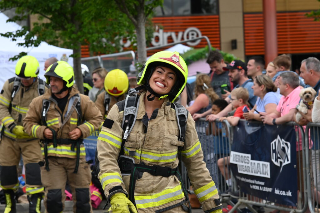 Firefighter outside smiling for the camera after taking part in a competition